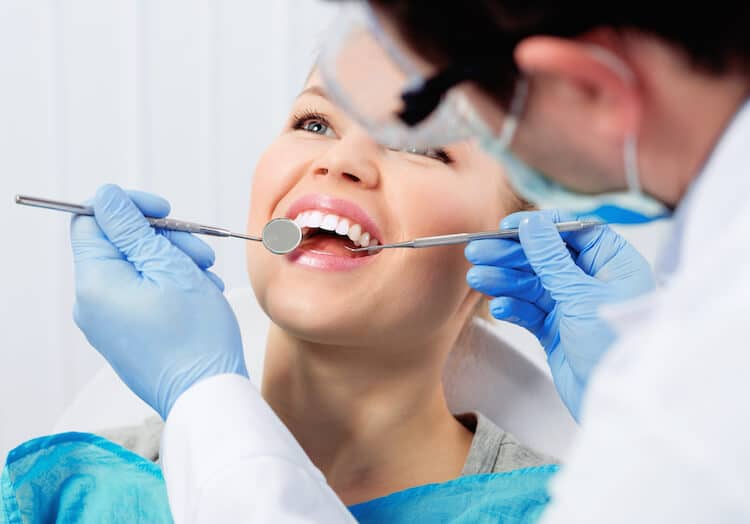 dentist examinig patient