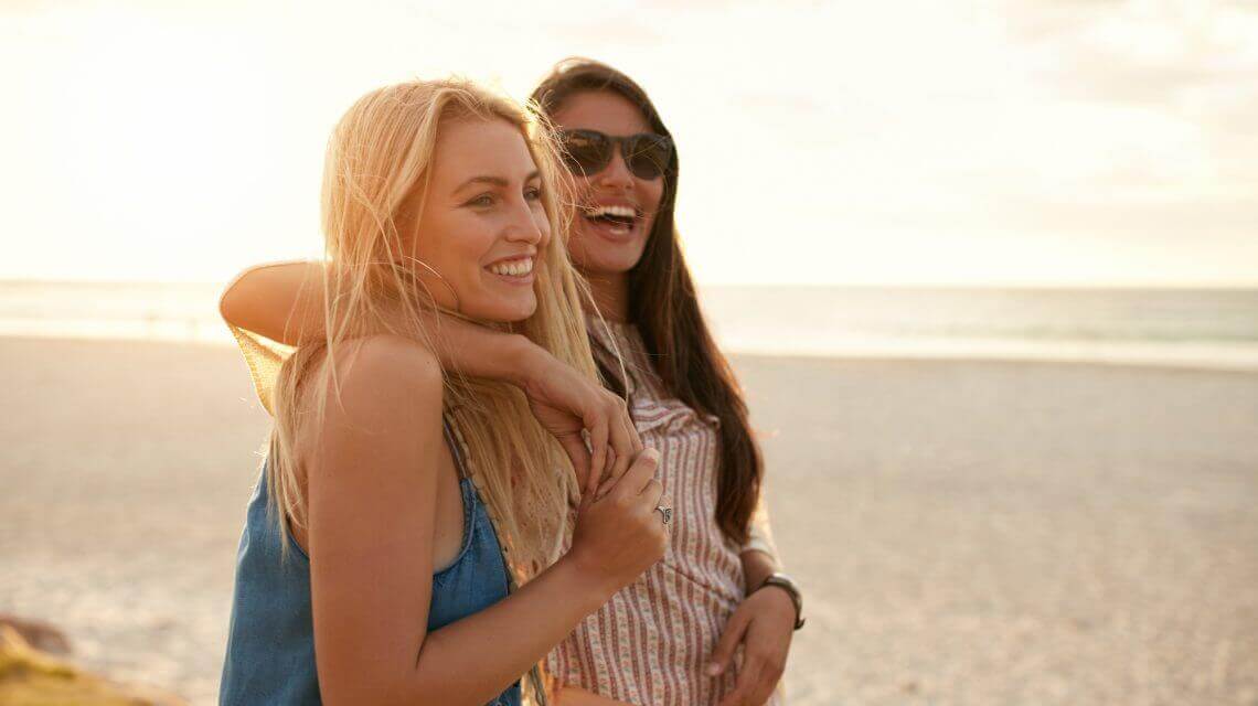 two females with arms around each other