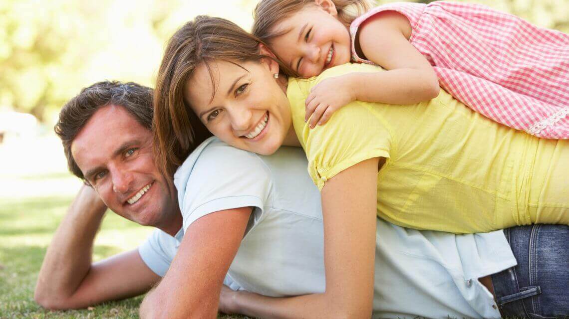 family lying on top of each other